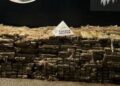 Caminhão carregado de maconha tomba em frente a batalhão da PM